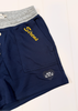 Navy blue shorts with a heather gray elastic waistband, featuring 'Screws' embroidered in yellow on the chest pocket and a black heart patch with a white anchor on the lower leg.