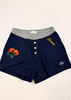 Navy blue shorts with a heather gray elastic waistband, featuring a three-button placket, embroidered orange roses on the left leg, yellow 'Stroops' text on the right leg, and a small heart patch on the lower right leg.