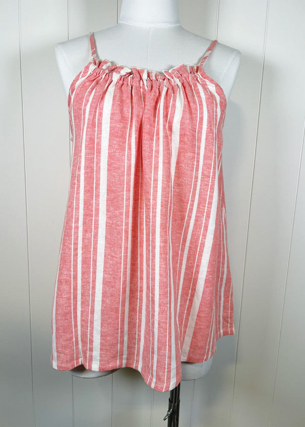 Red and white striped dress on a mannequin against a white background