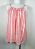 Red and white striped dress on a mannequin against a white background