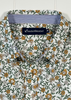 Floral patterned shirt with a brand label on a white background