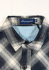 Plaid shirt with a visible brand label on a white background