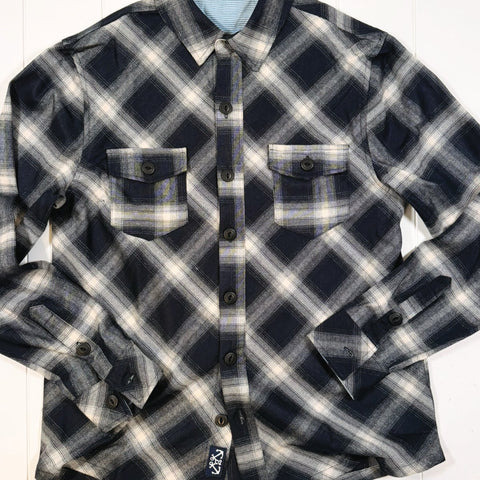 Plaid shirt with a brand label on a white background