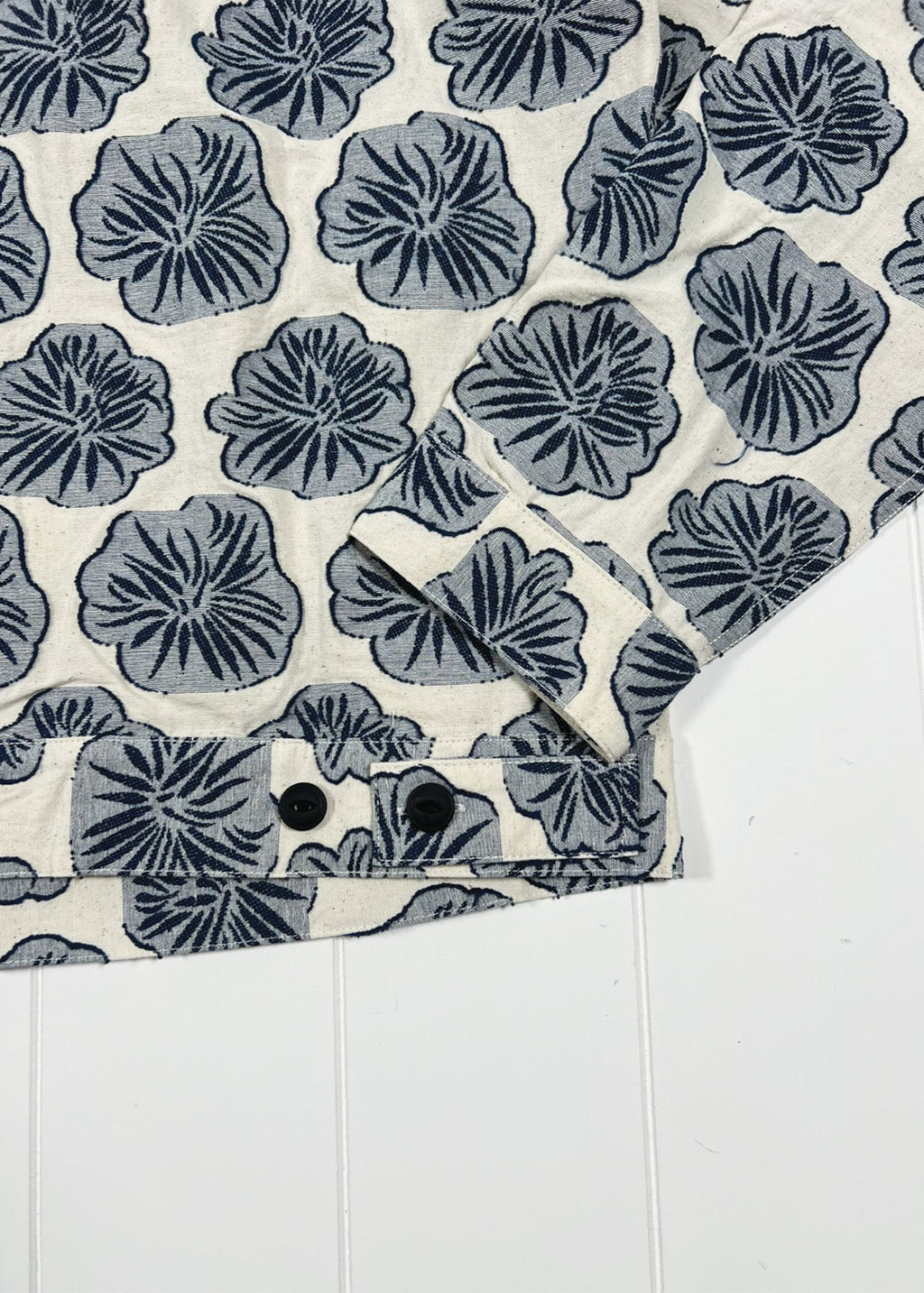 Floral patterned rug with blue flowers on a white background