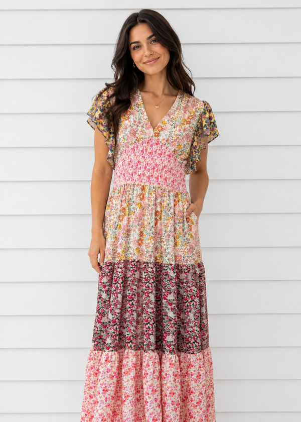 Woman wearing a floral dress with a white background