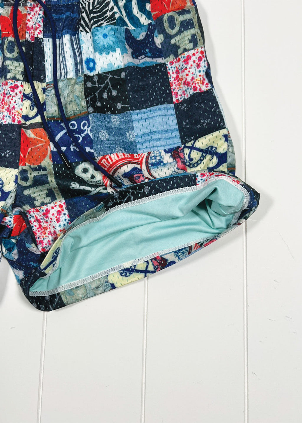 Patchwork quilt with colorful patterns on a white background