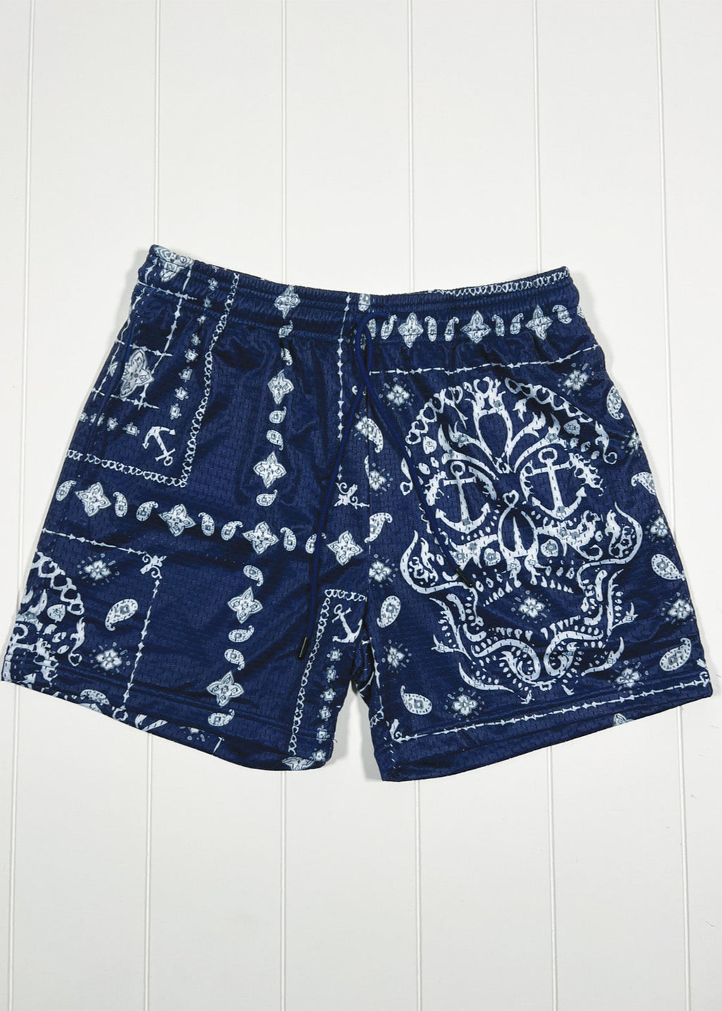 Blue shorts with white bandana pattern on a white background