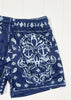 Navy blue shorts with white anchor and paisley pattern on a white background