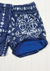 Blue shorts with white anchor pattern on a white background